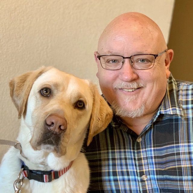 John Mayner with assistant dog